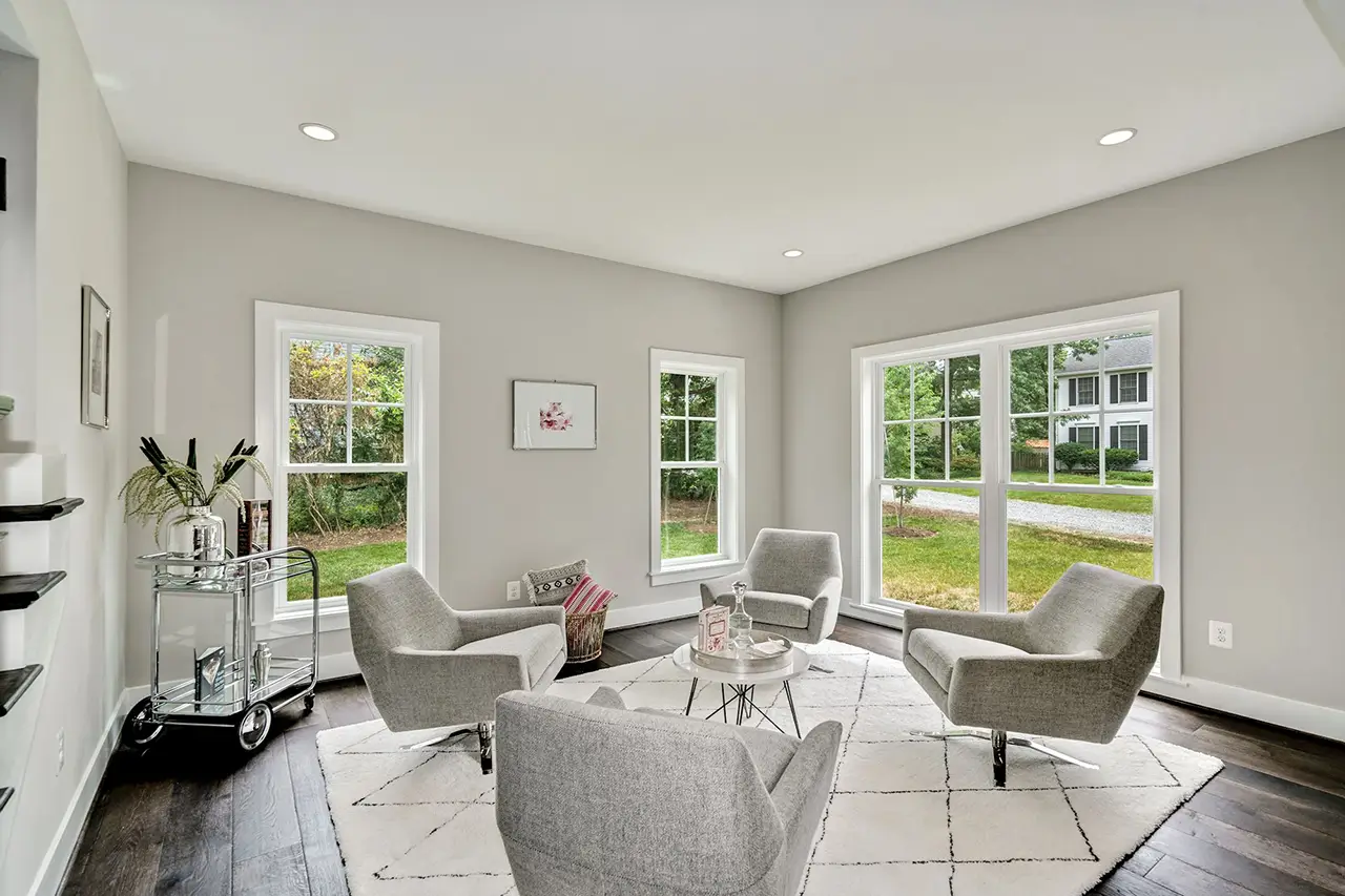 Living room with grey chairs and rug.